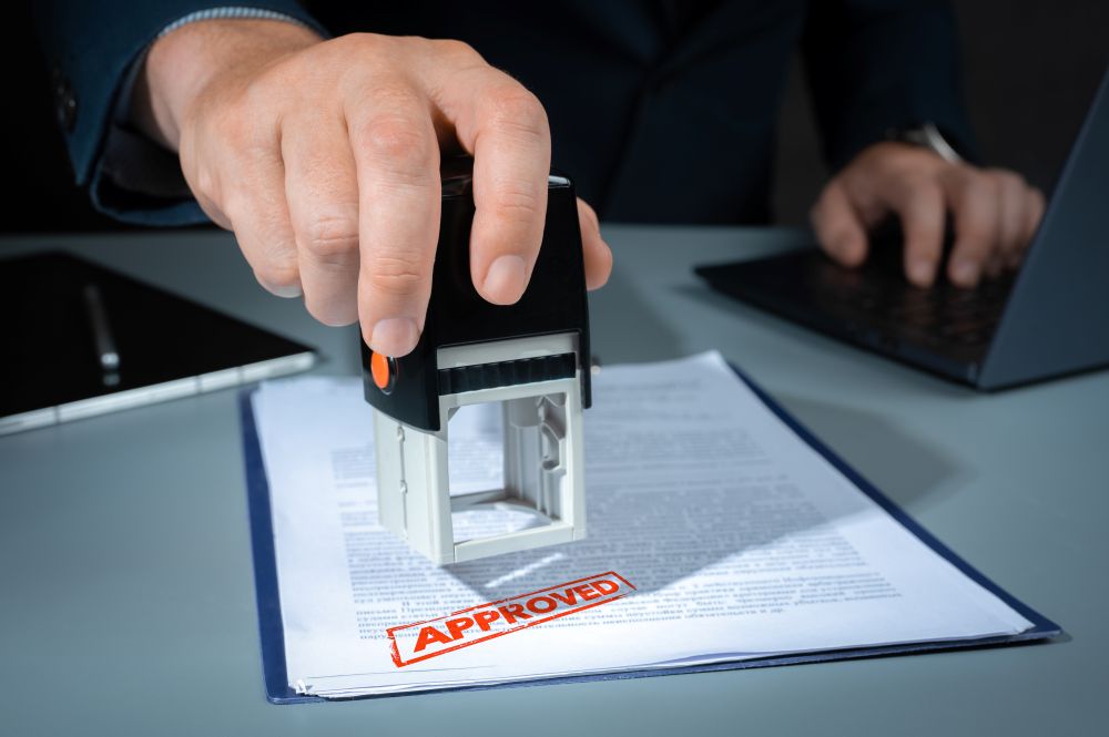 stamp-approved-approved-stamp-businessman-stamping-document-office-closeup-business-person-hand-stamping-approved-contract-form