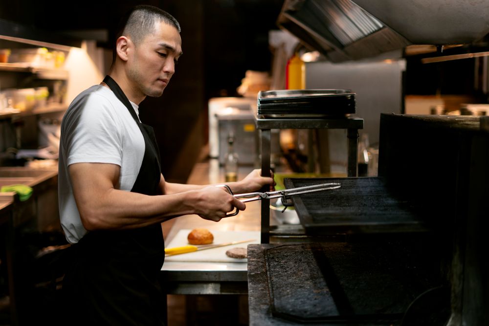 chef-cooking-kitchen-while-wearing-professional-attire